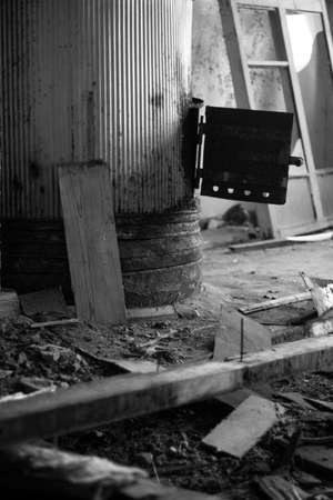 Black and white photo of a wooden column in an abandoned factory.の写真素材