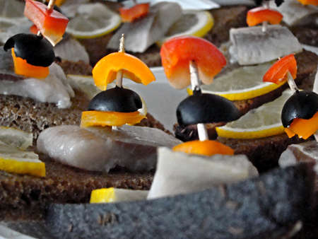 Sandwich with herring, pepper, lemon and brown breadの写真素材