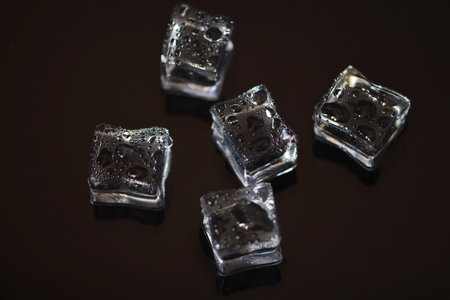 Ice cubes on a black background. Ice cubes on a black background.の写真素材