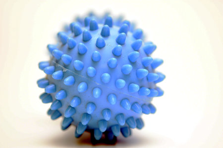 Blue massage ball on a white background. close-up. macro.の写真素材