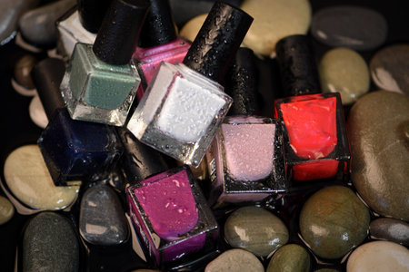 Group of colorful nail polishes on a black background. selective focus.の写真素材