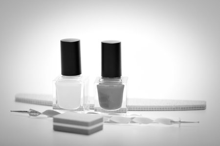 Nail polish and manicure tools on a white background. black and white photo.の写真素材