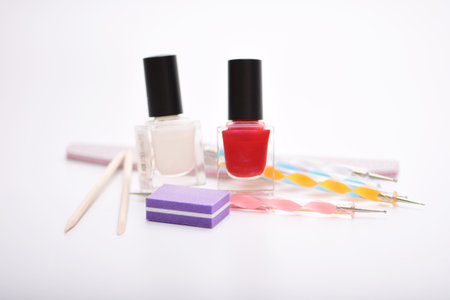 Nail polish and manicure tools on a white background. selective focus.の写真素材