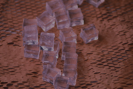sugar cubes on a brown background, close-up, macroの写真素材