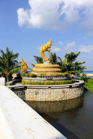 The religious art of Naga statue on the beach. Naga serpent deities in Hindu and Buddhist mythology.の写真素材