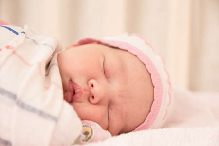 Very nice sweet baby girl sleeping in cribの写真素材