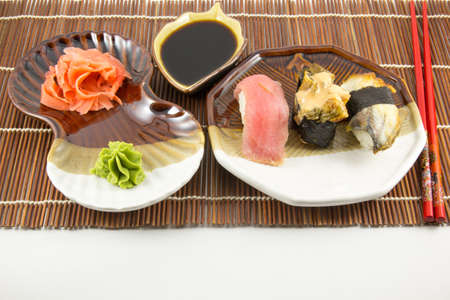 Sushi rolls with tuna and eel on white backgroundの写真素材