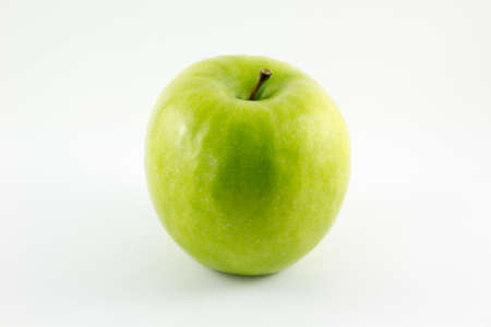 Green apple isolated on white backgroundの写真素材
