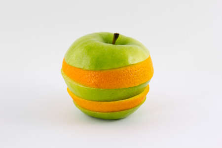 Mixed apple and orange isolated on white background conceptの写真素材