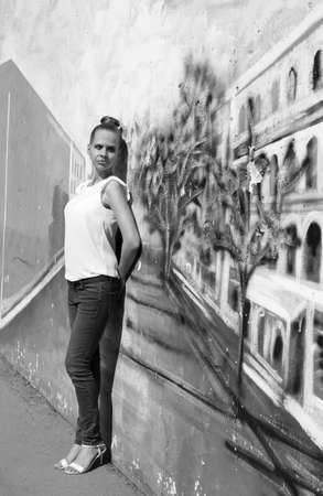 Girl on the background of street art black and whiteの写真素材