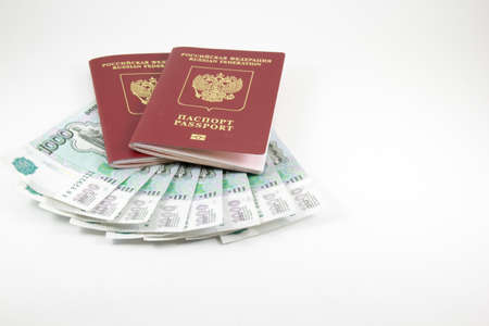 The passports of the Russian Federation and money on a white backgroundの写真素材