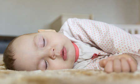 Portrait of a sleeping cute newborn babyの写真素材