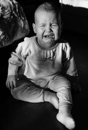 Portrait of a crying baby. The baby criesの写真素材