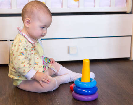 Cute baby playing with pyramid