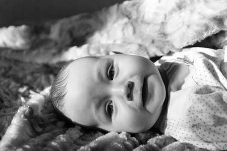 Portrait of a very beautiful cute babyの写真素材