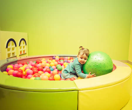 Beautiful portrait of a child playing on a children's playgroundの写真素材