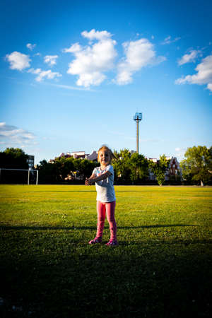 the child goes in for sports in the stadiumの写真素材
