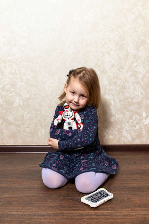 the child controls the robot from the remote controlの写真素材