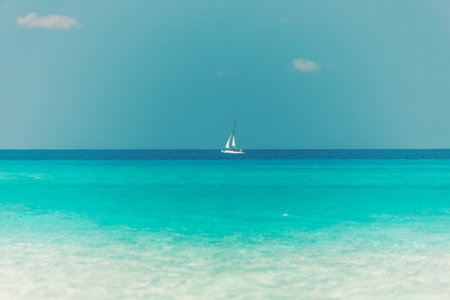 sailboat on the horizon, turquoise sea, beautiful landscapeの写真素材