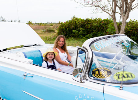 Varadero, Cuba - May 20, 2021: Oldsmobile Super 88 1959 in Cuba. People in a convertibleのeditorial素材