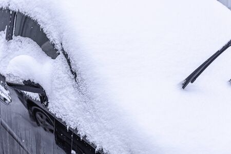 Snow covered car. Snowdrift of snow by car. Car standing in snow. Winter, snow, car in snowdrift.の写真素材