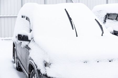 Car standing in snow. Snowdrift of snow by car. Snow covered car. Winter, snow, car in snowdrift.の写真素材