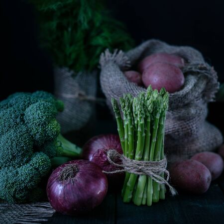 
Beautiful still life with a low key. Unusual moonlight from the window on raw food and lifestyle with a drop.の写真素材