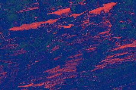Colorful (red, pink, yellow and purple) stone mosaic tiles on the wall as a background or texture. An abstract composition.の写真素材