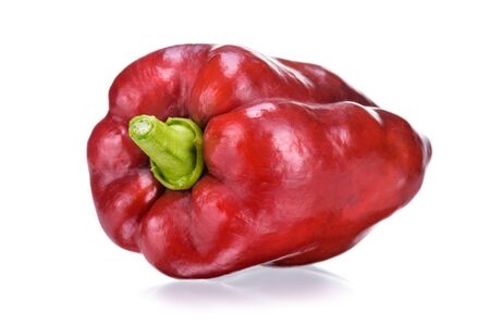 Closeup of red pepper on red background. Sweet red pepper. Isolated spices. Red dry chilli pepper background.の写真素材