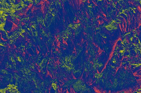 Colorful (red, pink, yellow and purple) stone mosaic tiles on the wall as a background or texture. An abstract composition.の写真素材