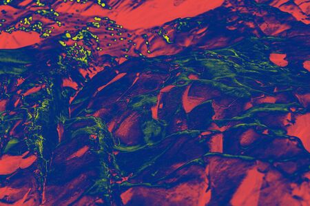 Colorful (red, pink, yellow and purple) stone mosaic tiles on the wall as a background or texture. An abstract composition.の写真素材
