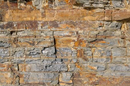 Texture of a dark gray stone or background for design.
The surface of the rock is a surface with a wave pattern.の写真素材
