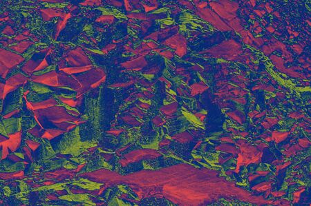 Colorful (red, pink, yellow and purple) stone mosaic tiles on the wall as a background or texture. An abstract composition.の写真素材