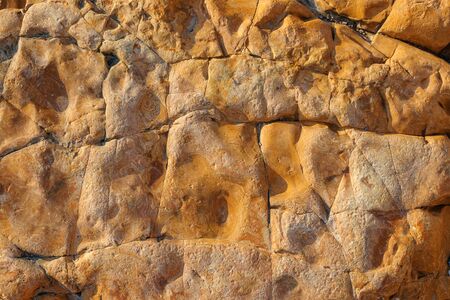 The natural stone or the surface of the stone as a background texture is large.