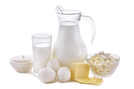 Dairy products on white background. Milk, cottage cheese, sour cream, cheese, butter, eggs, still life from healthy dairy products.の写真素材