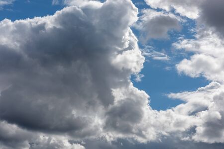 The blue sky with white clouds, in the rays of sunlight.の写真素材