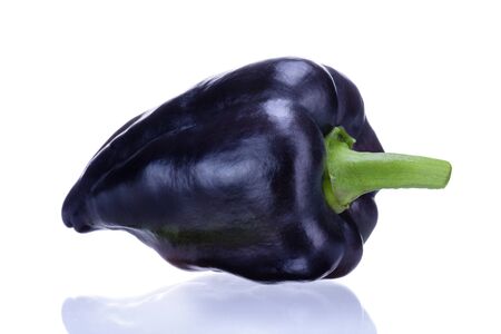 Sweet, black bulgarian pepper, close-up on a white background. Fresh juicy vegetables.の写真素材