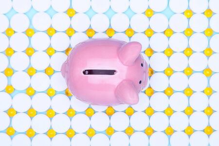 Various medications: pills, blister pills, drugs, macros, copy space on a blue background.Kapilka pig against the background of narcotic drugs.の写真素材