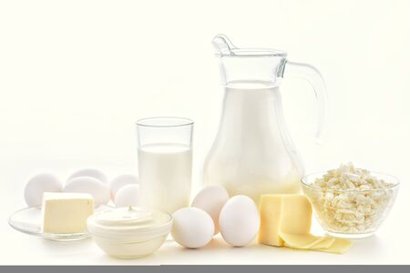 Milk, cottage cheese, sour cream, cheese, butter, eggs, still life from fresh dairy products. The usefulness of milk, dairy products from milk for adults and children. Still life of dairy products.の写真素材