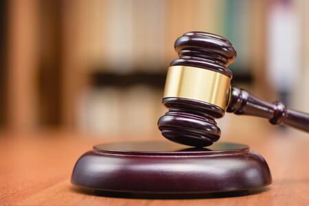 Justice and law concept. Wooden hammer of the judge. Court and decision. Judge hammer on the wooden table.の写真素材