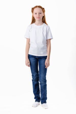Girl In White T-Shirt. Young caucasian, european woman, girl in blank white t-shirt. White T-shirt on a white background. Shirts front view isolated.の写真素材