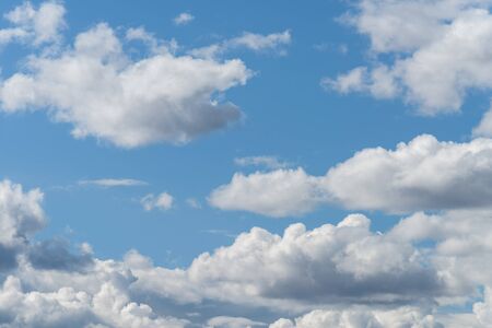 The blue sky with white clouds, in the rays of sunlight.の写真素材