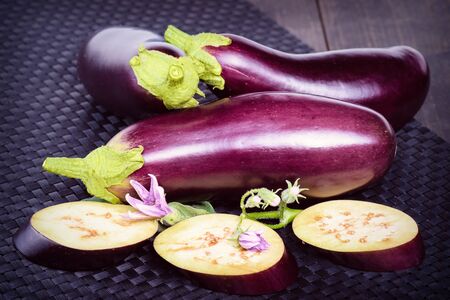 Dietary healthy food. Eggplant on the table. Eggplant. Fresh sliced eggplant. Delicious pieces of eggplant on a beautiful napkin, lying on the table.の写真素材