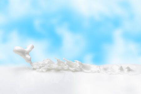Exit the dragon.Milk splash or milk against a blue sky in the form of a milk dragon.White dragon in the form of a milk splash in the clouds.の写真素材
