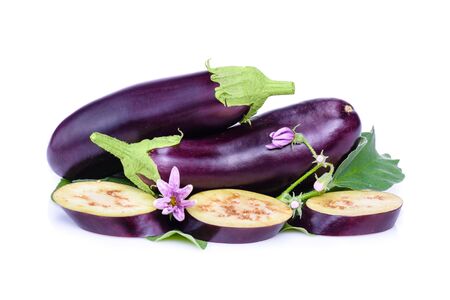 Vegetables isolated on white background. Fresh eggplants from flower beds, with leaves and flowers on a white background. Sliced eggplant isolated.Creative layout fresh eggplants. Concept of healthy eating. の写真素材