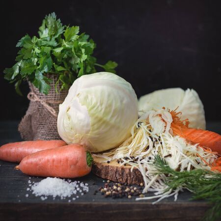 Still life with raw vegetables on a wooden shelf in the basement. Rustic pattern of vegetables.の写真素材