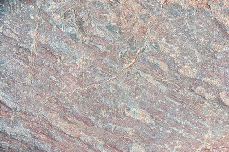 Stone texture. Stone old wall. Granite natural surface. Texture pattern. Natural stone close-up. Structural surface close-up.の写真素材