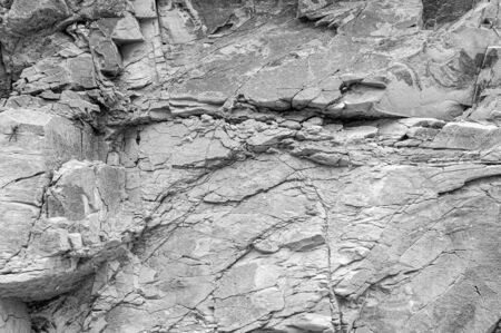 Stone texture. Structural surface close-up. Stone old wall.  Granite natural surface. Texture pattern. Natural stone close-up.の写真素材