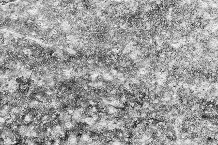 Granite natural surface. Stone texture. Stone old wall. Texture pattern. Natural stone close-up. Structural surface close-up. Soft focus on the background. Selective focus on the background.の写真素材