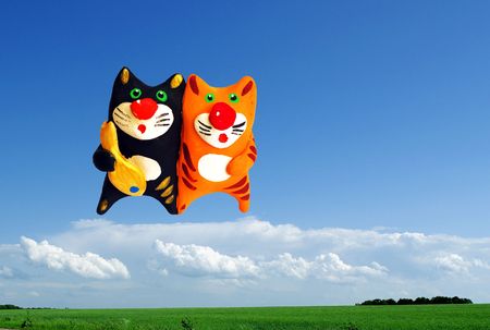 Two cats in the sky with fishの写真素材
